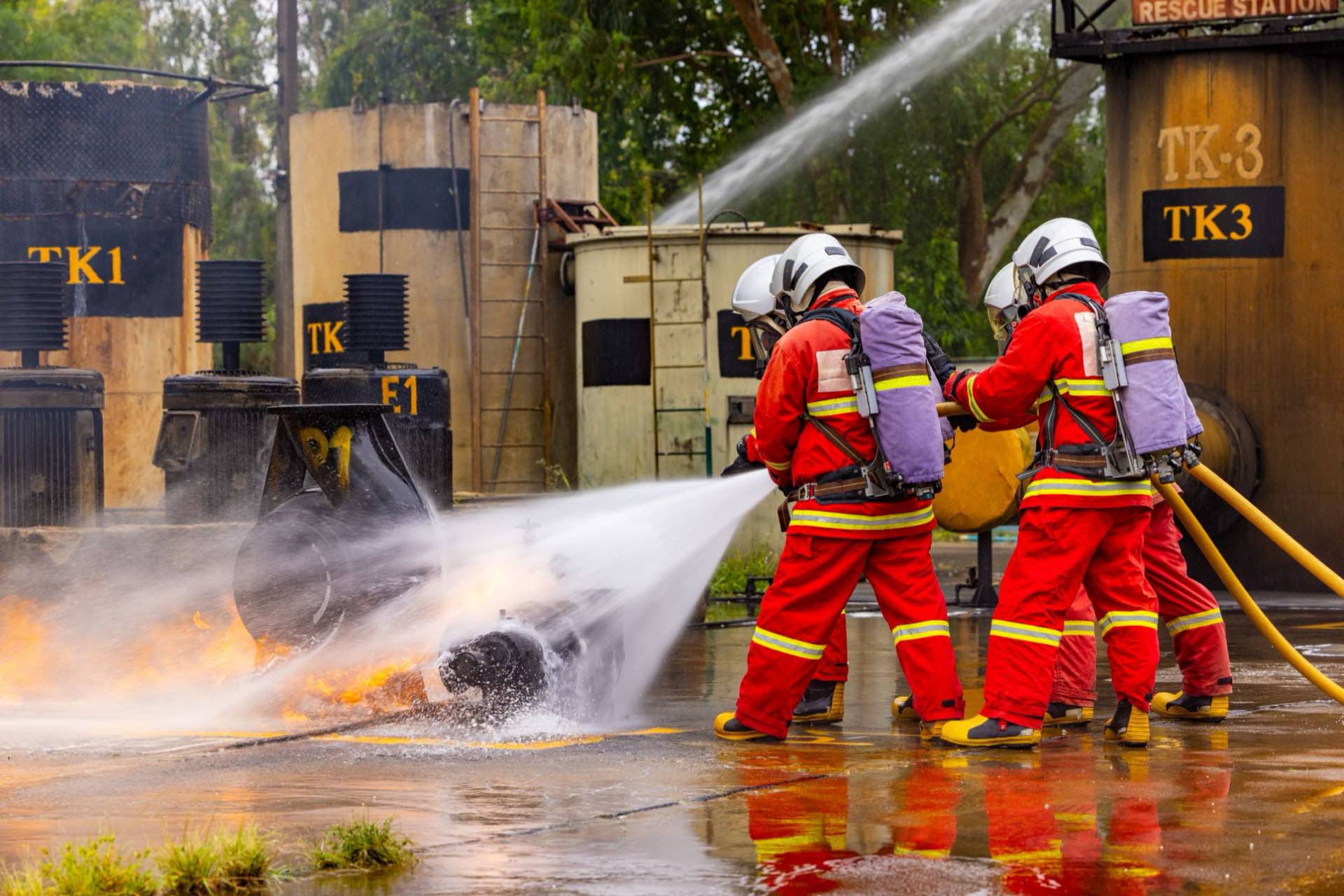 Firefighters training with a hose line