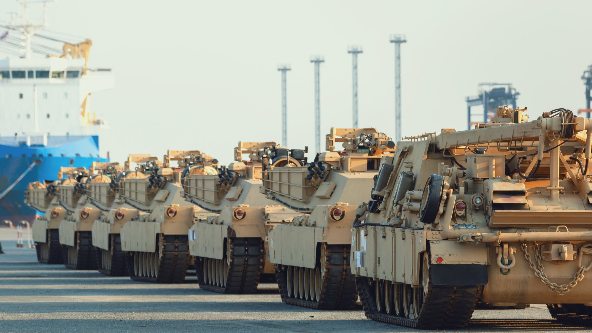 Military vehicles staged at a port